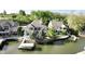Waterfront home with a private dock and boat lift on a tree-lined lot at 14035 Stone Key Way, Fishers, IN 46040