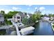 Beautiful waterfront home with private dock, boat lift, and manicured grounds at 14035 Stone Key Way, Fishers, IN 46040
