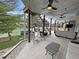 Spacious backyard with seating area, hot tub, and outdoor stairs to the upper balcony overlooking canal at 14035 Stone Key Way, Fishers, IN 46040