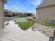 Backyard and lake with boat docks as seen from a deck and patio at 14035 Stone Key Way, Fishers, IN 46040