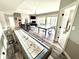 Finished basement features shuffleboard, fireplace, pool table, ping pong, and game table at 14035 Stone Key Way, Fishers, IN 46040