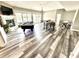 Spacious basement with hardwood style floors, fireplace, pool table, ping pong and game table at 14035 Stone Key Way, Fishers, IN 46040