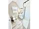 Modern bathroom with a glass-enclosed shower, toilet, and vanity with sink under a window for natural light at 14035 Stone Key Way, Fishers, IN 46040