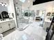Beautiful bathroom with marble floors, double vanity, glass shower and a relaxing soaking tub at 14035 Stone Key Way, Fishers, IN 46040