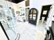 Bathroom featuring walk-in shower, double vanity, and nearby closet for linen and storage at 14035 Stone Key Way, Fishers, IN 46040