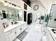 Sleek bathroom boasting marble floors, a large vanity with modern fixtures, and a glass-enclosed shower at 14035 Stone Key Way, Fishers, IN 46040