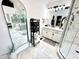 Bright bathroom features dual vanity, a glass-enclosed shower, and a soaking tub at 14035 Stone Key Way, Fishers, IN 46040