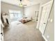 Neutral toned bedroom with a large window and plush carpet at 14035 Stone Key Way, Fishers, IN 46040