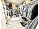Large walk-in closet with ample shelving, clothes racks, and storage for shoes and accessories at 14035 Stone Key Way, Fishers, IN 46040