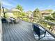Outdoor deck featuring dining set, lounge seating and a scenic waterfront view with the American flag at 14035 Stone Key Way, Fishers, IN 46040