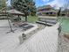 Private dock with lounge chairs, umbrella, and a boat lift overlooking the tranquil water at 14035 Stone Key Way, Fishers, IN 46040
