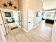 Inviting entryway with wood floors that leads into a cozy office and living space at 14035 Stone Key Way, Fishers, IN 46040