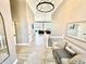 Inviting foyer with high ceilings, decorative lighting, and a view into the living area at 14035 Stone Key Way, Fishers, IN 46040