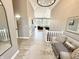 Bright foyer features a decorative chandelier, neutral tones and ample natural light at 14035 Stone Key Way, Fishers, IN 46040