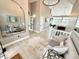 Open foyer with coat nook, light wood floors and soft, neutral tones at 14035 Stone Key Way, Fishers, IN 46040