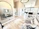 Elegant foyer with a view of the living room, featuring stylish decor and ample natural light at 14035 Stone Key Way, Fishers, IN 46040