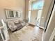 Inviting foyer features a large window, a cozy seating area and light wood floors at 14035 Stone Key Way, Fishers, IN 46040