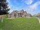Well-maintained brick home with a spacious lawn and picturesque landscaping at 14035 Stone Key Way, Fishers, IN 46040