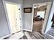 Hallway view of a home office with desk and large window at 14035 Stone Key Way, Fishers, IN 46040