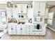 Modern kitchen with white cabinets, updated appliances, and ample counter space for cooking and entertaining at 14035 Stone Key Way, Fishers, IN 46040