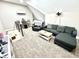 Relaxing living room with plush seating, a mini-split AC system, and a cozy atmosphere perfect for downtime at 14035 Stone Key Way, Fishers, IN 46040