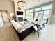 Bright living room with a stone fireplace, vaulted ceiling, and seamless access to an outdoor patio at 14035 Stone Key Way, Fishers, IN 46040