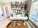 Comfortable home office space featuring stylish shelves, a modern desk, and a cozy seating area at 14035 Stone Key Way, Fishers, IN 46040