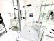 Stylish marble shower with glass doors, showcasing modern fixtures and a built-in shelf for toiletries at 14035 Stone Key Way, Fishers, IN 46040