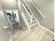 Staircase leading into basement, offering view to dining room at 14035 Stone Key Way, Fishers, IN 46040