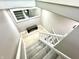View of staircase, leading to lower level with bench at landing at 14035 Stone Key Way, Fishers, IN 46040