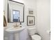 Bathroom featuring a pedestal sink, framed mirror, and crisp, white walls at 1452 Bigleaf Dr, Sheridan, IN 46069