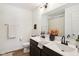 Bright bathroom featuring a double sink vanity, framed mirror, and modern fixtures at 1452 Bigleaf Dr, Sheridan, IN 46069