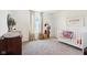The Bedroom features patterned curtains, ample natural light, and a decorative rug at 1452 Bigleaf Dr, Sheridan, IN 46069