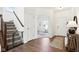 Welcoming foyer with hardwood floors and a staircase, leading to additional rooms in the home at 1452 Bigleaf Dr, Sheridan, IN 46069