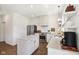 Beautiful kitchen with granite counters, an island, stainless steel appliances, and open shelving at 1452 Bigleaf Dr, Sheridan, IN 46069