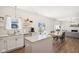 Bright kitchen overlooking the dining and living areas with modern appliances at 1452 Bigleaf Dr, Sheridan, IN 46069