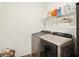 Laundry room with modern stainless steel washer and dryer and plenty of storage at 1452 Bigleaf Dr, Sheridan, IN 46069