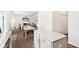 Open-concept dining and living area with hardwood floors and natural light at 1452 Bigleaf Dr, Sheridan, IN 46069