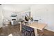 Bright living room featuring a fireplace, dining area, and modern chandelier at 1452 Bigleaf Dr, Sheridan, IN 46069