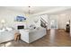 Bright living room with fireplace, hardwood floors, comfortable seating, and access to other rooms at 1452 Bigleaf Dr, Sheridan, IN 46069