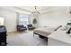 The spacious main bedroom is bright and features modern lighting fixtures, and comfortable seating at 1452 Bigleaf Dr, Sheridan, IN 46069