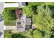 Aerial view showcasing the property's layout and landscaping with mature trees and outdoor living spaces at 14728 Adios Pass, Carmel, IN 46032