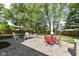 Charming backyard with stone patio, outdoor seating, and a well-maintained fence at 14728 Adios Pass, Carmel, IN 46032