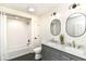 Stylish bathroom with double vanity, modern fixtures, and a shower with a bathtub at 14728 Adios Pass, Carmel, IN 46032