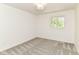 A cozy bedroom with neutral carpet and plenty of natural light from a large window at 14728 Adios Pass, Carmel, IN 46032