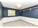 Bedroom features two-tone paint, natural light, soft carpet, and classic trim work at 14728 Adios Pass, Carmel, IN 46032