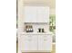 Kitchenette with white shaker cabinets, light countertops and backyard view at 14728 Adios Pass, Carmel, IN 46032