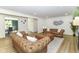 Spacious living room features modern vinyl floors, a stylish fireplace, and two matching Chesterfield sofas at 14728 Adios Pass, Carmel, IN 46032