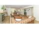 Open-concept living room features a contemporary fireplace, modern vinyl floors, and flows seamlessly into the adjacent kitchen at 14728 Adios Pass, Carmel, IN 46032
