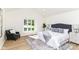 Bright and airy main bedroom with a large window, stylish furniture, and vaulted ceiling at 14728 Adios Pass, Carmel, IN 46032